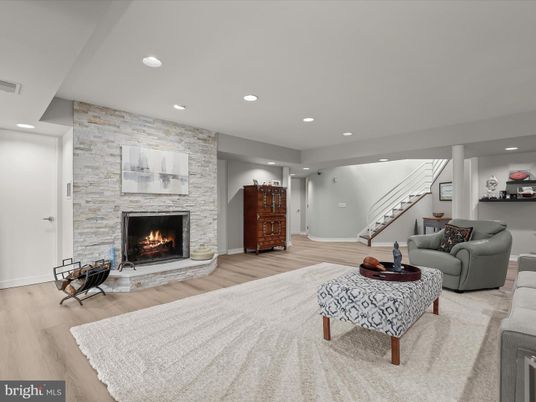 Fireplace, Interior, Living room, Recessed Lighting, Stone Walls, Wood Texture Flooring