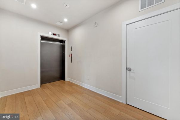 Elevator, Interior, Recessed Lighting, Wood Texture Flooring