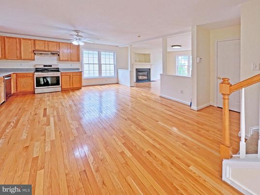 Empty room, Fireplace, Interior, Kitchen, Stainless Steel Appliances, Wood Texture Flooring