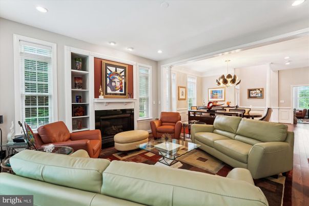 Dining room, Fireplace, Interior, Living room, Pendant Lights, Recessed Lighting, Wood Texture Flooring