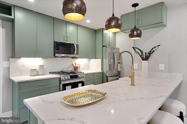 Interior, Kitchen, Marble Walls, Pendant Lights, Recessed Lighting, Stainless Steel Appliances