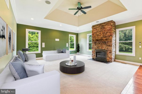 Fireplace, Interior, Living room, Recessed Lighting, Stone Walls, Wood Texture Flooring