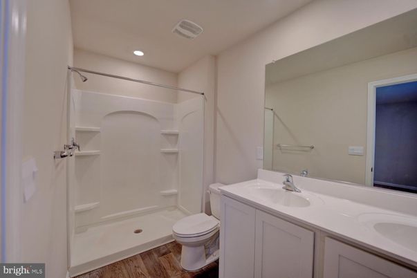 Bathroom, Dual Sink Vanities, Interior, Recessed Lighting, Wood Texture Flooring