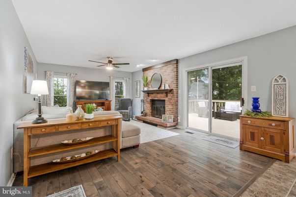Fireplace, Interior, Living room, Recessed Lighting, Stone Walls, Wood Texture Flooring