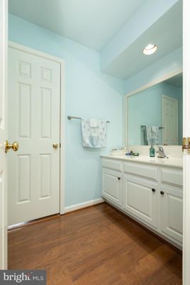 Bathroom, Dual Sink Vanities, Interior, Recessed Lighting, Wood Texture Flooring