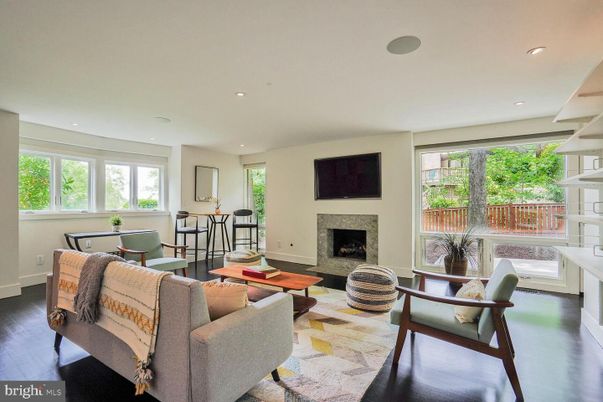 Dining room, Fireplace, Interior, Living room, Recessed Lighting, Wood Texture Flooring