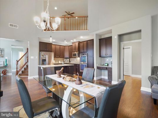Chandelier, Dining room, Interior, Kitchen, Recessed Lighting, Stainless Steel Appliances, Wood Texture Flooring