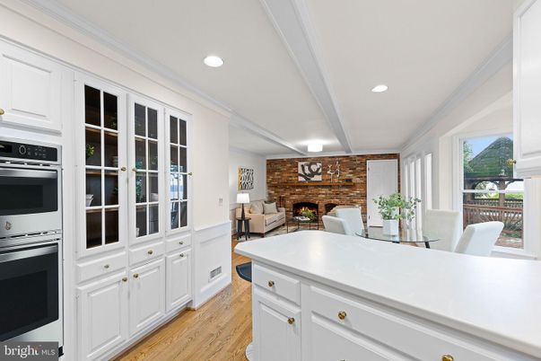 Dining room, Fireplace, Interior, Kitchen, Living room, Recessed Lighting, Stainless Steel Appliances, Stone Walls, Wood Texture Flooring