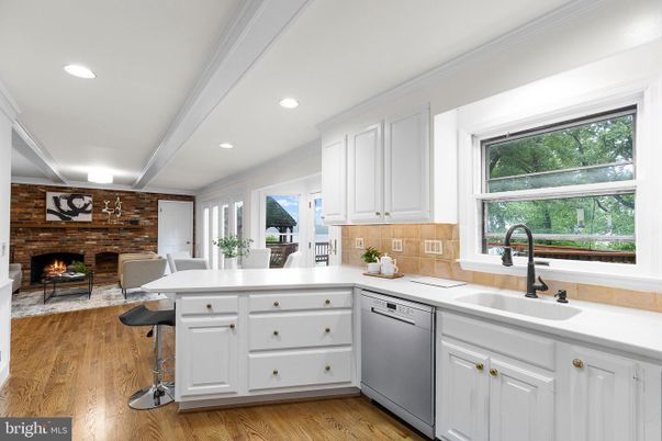 Dining room, Fireplace, Interior, Kitchen, Recessed Lighting, Stone Walls, Wood Texture Flooring