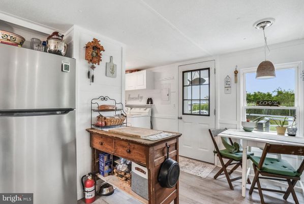 Dining room, Interior, Kitchen, Pendant Lights, Stainless Steel Appliances, Wood Texture Flooring