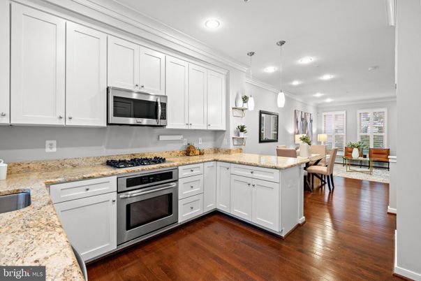 Dining room, Interior, Kitchen, Pendant Lights, Recessed Lighting, Stainless Steel Appliances, Wood Texture Flooring