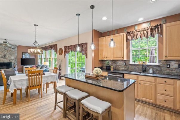 Chandelier, Dining room, Fireplace, Interior, Kitchen, Pendant Lights, Recessed Lighting, Stone Walls, Wood Texture Flooring