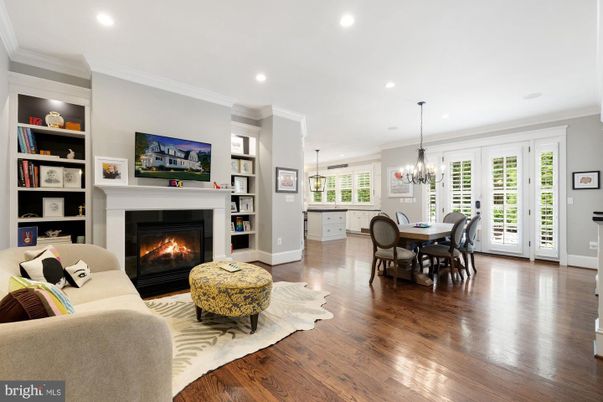 Chandelier, Dining room, Fireplace, Interior, Living room, Pendant Lights, Recessed Lighting, Wood Texture Flooring
