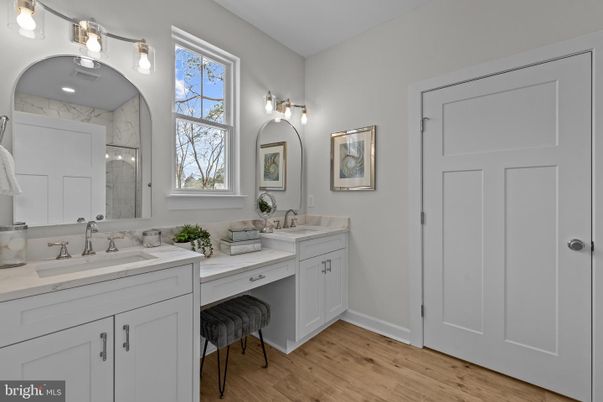 Bathroom, Dual Sink Vanities, Interior, Marble Walls, Wood Texture Flooring