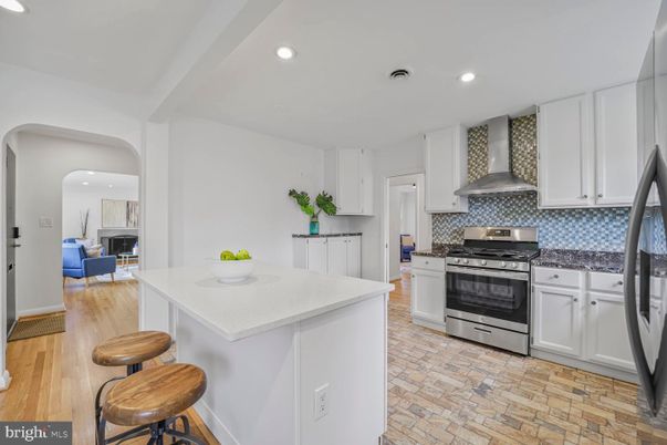 Fireplace, Interior, Kitchen, Recessed Lighting, Stainless Steel Appliances, Wood Texture Flooring