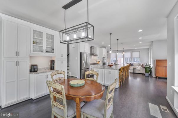 Dining room, Interior, Kitchen, Pendant Lights, Recessed Lighting, Stainless Steel Appliances, Wood Texture Flooring