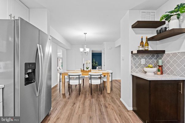 Chandelier, Dining room, Interior, Kitchen, Stainless Steel Appliances, Wood Texture Flooring