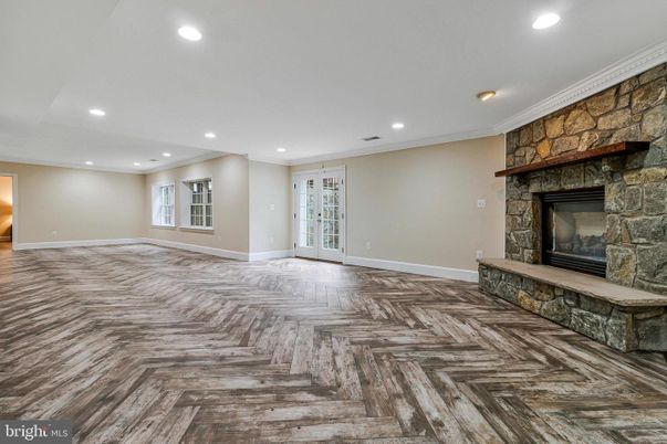 Empty room, Fireplace, Interior, Recessed Lighting, Stone Walls, Wood Texture Flooring