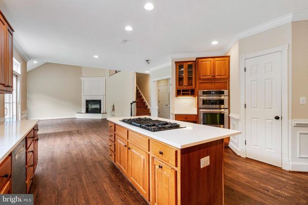 Fireplace, Interior, Kitchen, Recessed Lighting, Stainless Steel Appliances, Wood Texture Flooring