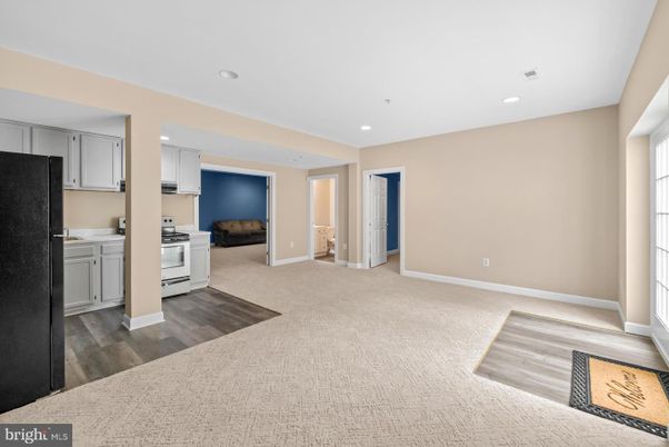 Interior, Kitchen, Recessed Lighting, Washer, Wood Texture Flooring