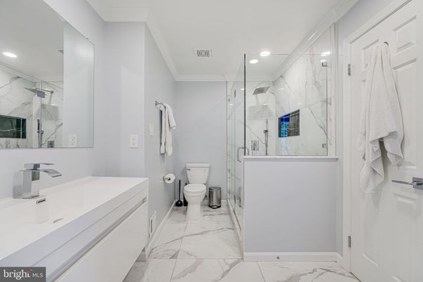 Bathroom, Dual Sink Vanities, Glass Shower, Interior, Marble, Marble Walls, Recessed Lighting