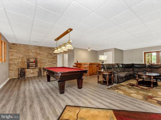 Billiard Table, Game Room, Interior, Living room, Pendant Lights, Recessed Lighting, Stone Walls, Wood Texture Flooring