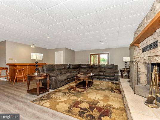 Fireplace, Interior, Living room, Recessed Lighting, Stone Walls, Wood Texture Flooring