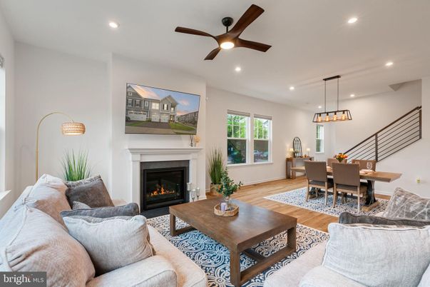 Dining room, Fireplace, Interior, Living room, Pendant Lights, Recessed Lighting, Wood Texture Flooring