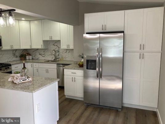 Interior, Kitchen, Marble Walls, Stainless Steel Appliances, Wood Texture Flooring