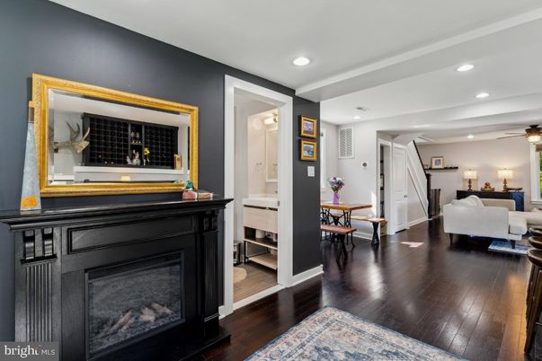 Dining room, Fireplace, Interior, Living room, Recessed Lighting, Wood Texture Flooring