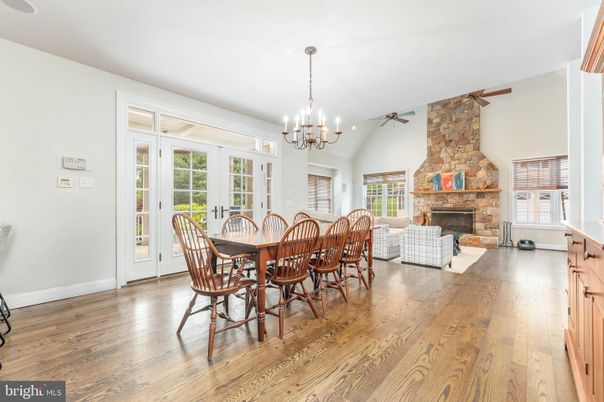 Chandelier, Dining room, Fireplace, Interior, Living room, Stone Walls, Wood Texture Flooring