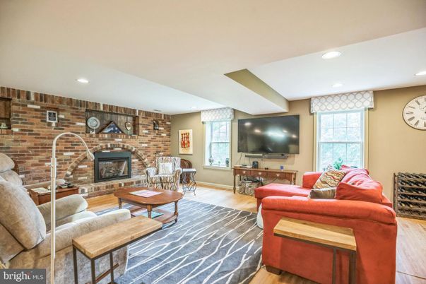 Fireplace, Interior, Living room, Recessed Lighting, Stone Walls, Wood Texture Flooring