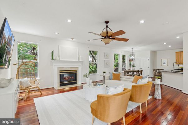 Dining room, Fireplace, Interior, Living room, Pendant Lights, Recessed Lighting, Wood Texture Flooring