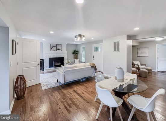 Dining room, Fireplace, Interior, Living room, Recessed Lighting, Wood Texture Flooring