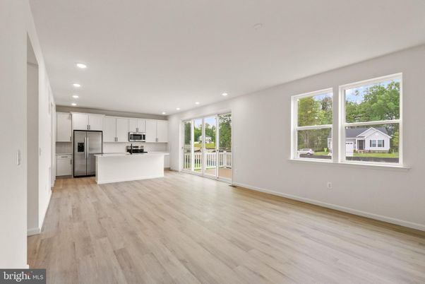 Empty room, Interior, Kitchen, Recessed Lighting, Stainless Steel Appliances, Wood Texture Flooring
