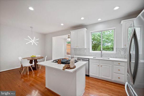 Dining room, Interior, Kitchen, Recessed Lighting, Stainless Steel Appliances, Wood Texture Flooring