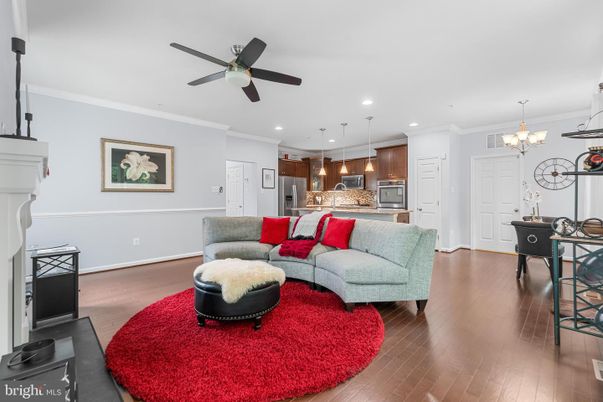 Chandelier, Interior, Kitchen, Living room, Pendant Lights, Recessed Lighting, Stainless Steel Appliances, Wood Texture Flooring