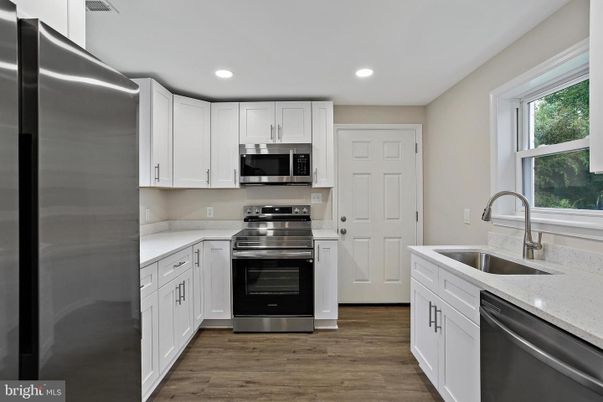 Interior, Kitchen, Recessed Lighting, Stainless Steel Appliances, Wood Texture Flooring