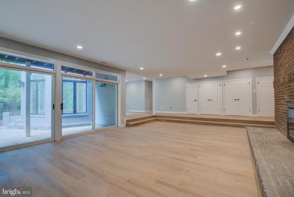 Empty room, Fireplace, Interior, Recessed Lighting, Stone Walls, Wood Texture Flooring