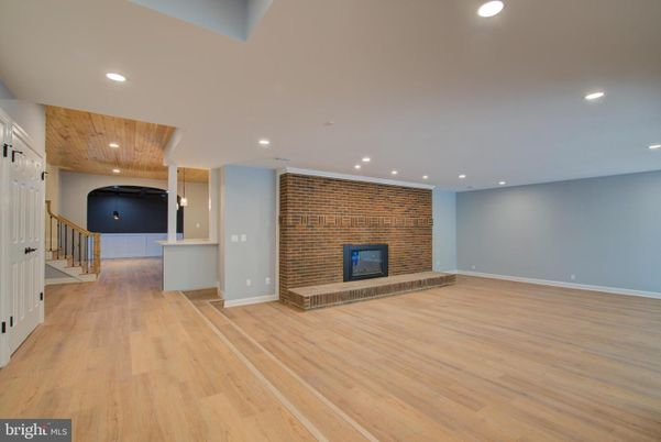 Empty room, Fireplace, Interior, Recessed Lighting, Stone Walls, Wood Texture Flooring