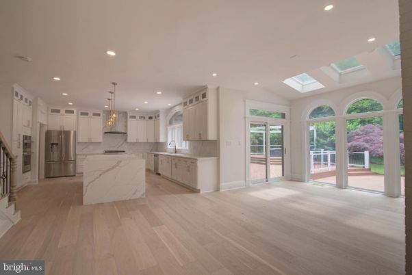 Interior, Kitchen, Marble Walls, Pendant Lights, Recessed Lighting, Stainless Steel Appliances, Wood Texture Flooring