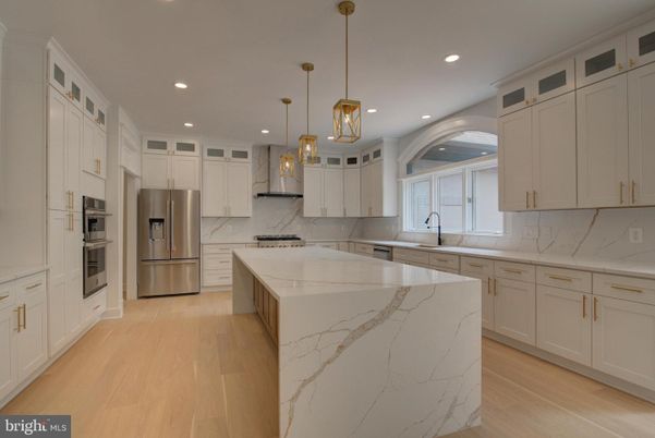 Interior, Kitchen, Marble Walls, Pendant Lights, Recessed Lighting, Stainless Steel Appliances, Wood Texture Flooring