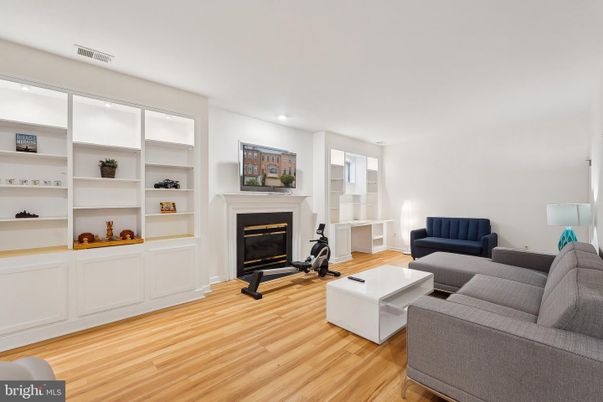 Fireplace, Fitness Equipment, Interior, Living room, Recessed Lighting, Wood Texture Flooring