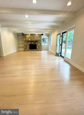 Empty room, Fireplace, Interior, Recessed Lighting, Stone Walls, Wood Texture Flooring