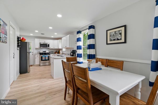 Dining room, Interior, Kitchen, Recessed Lighting, Stainless Steel Appliances, Wood Texture Flooring