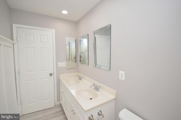 Bathroom, Dual Sink Vanities, Interior, Recessed Lighting, Wood Texture Flooring