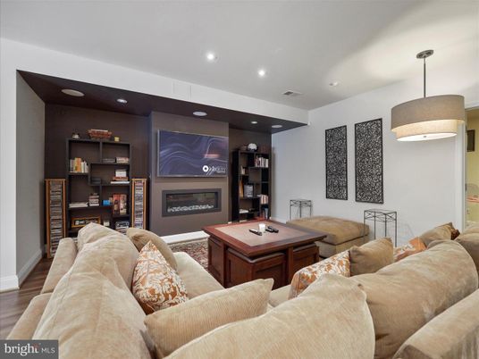Fireplace, Game Room, Interior, Living room, Recessed Lighting, Wood Texture Flooring