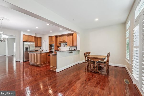 Chandelier, Dining room, Interior, Kitchen, Pendant Lights, Recessed Lighting, Stainless Steel Appliances, Wood Texture Flooring