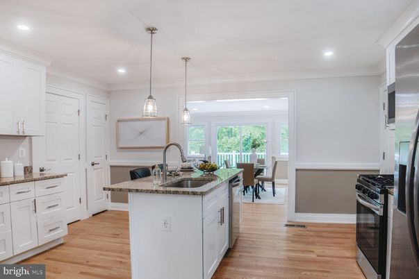 Dining room, Interior, Kitchen, Pendant Lights, Recessed Lighting, Stainless Steel Appliances, Wood Texture Flooring