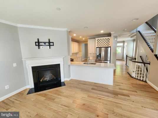 Fireplace, Interior, Kitchen, Recessed Lighting, Stainless Steel Appliances, Wood Texture Flooring